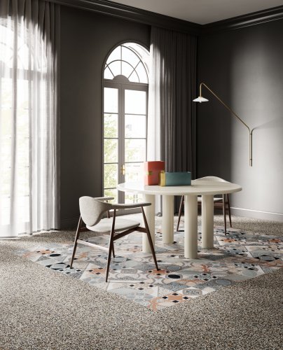 Une salle à manger revêtue de carrelage intérieur aspect carreaux ciment.