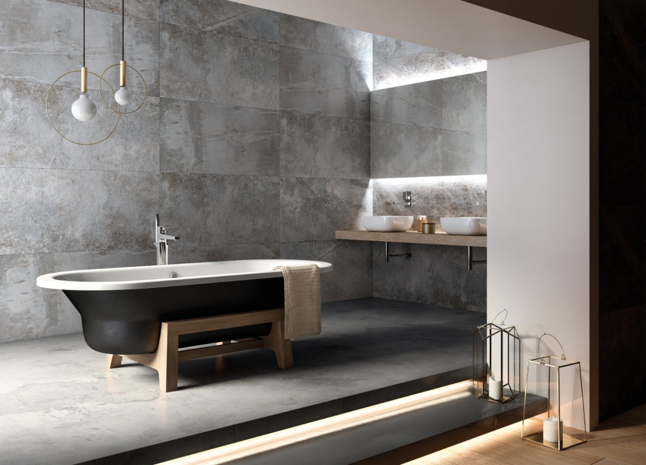 Baignoire ilot et carrelage gris pour une salle de bains moderne.
