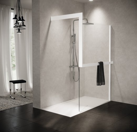 Salle de bains avec carrelage gris et paroi douche italienne.