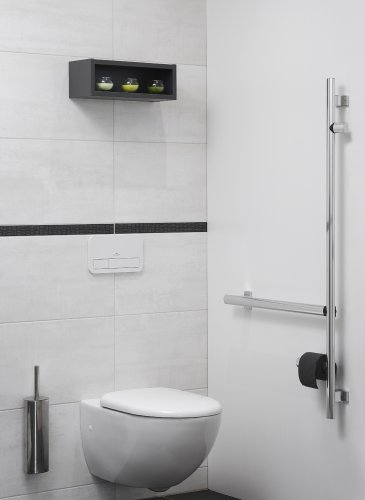 Carrelage toilettes blanc avec cuvette de WC suspendue pour Personnes à Mobilité Réduite PMR.