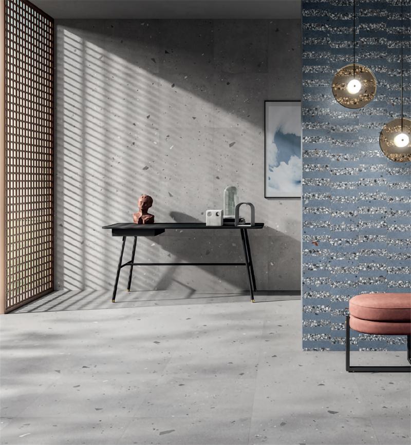 Salon avec carrelage terrazzo sol et mur gris et bleu