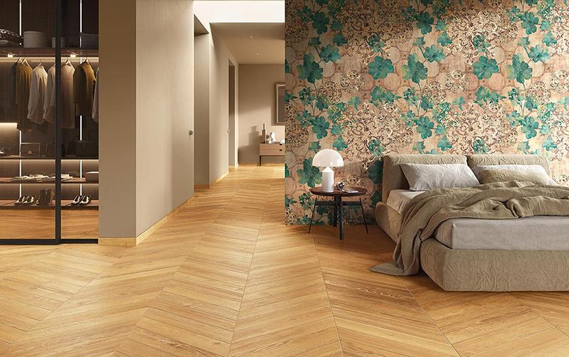 Chambre parentale et dressing avec un carrelage imitation bois posé en chevron